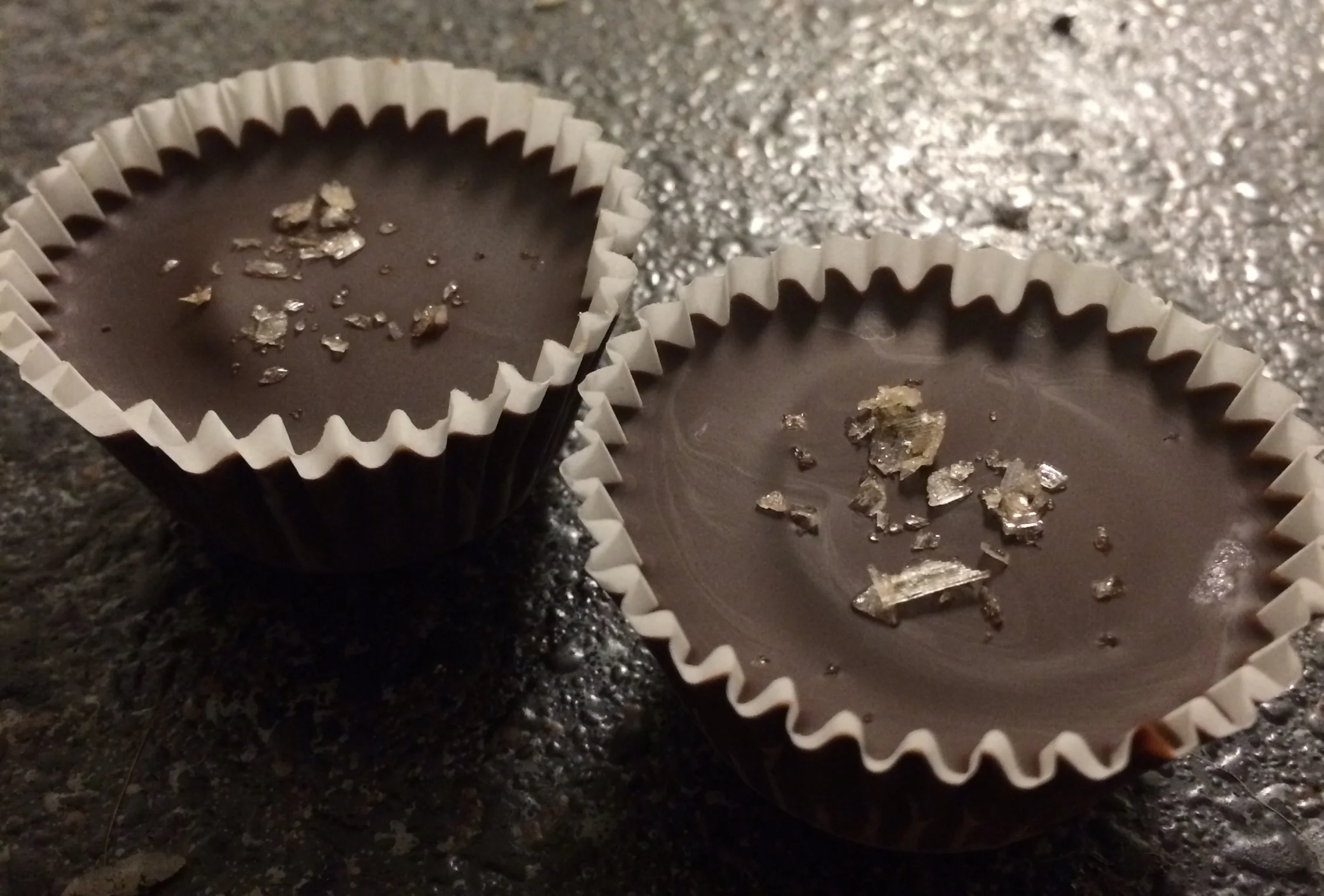 Dark chocolate, almond butter and banana cups topped with sea salt