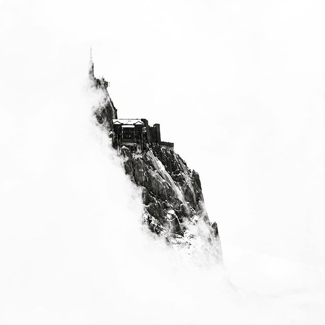 Peeking through the clouds and standing tall above the French town of Chamonix is the Aiguille du Midii. This formidable, yet accessible, mountain is a popular destination for professional climbers and casual tourists alike. It's rugged beauty remote