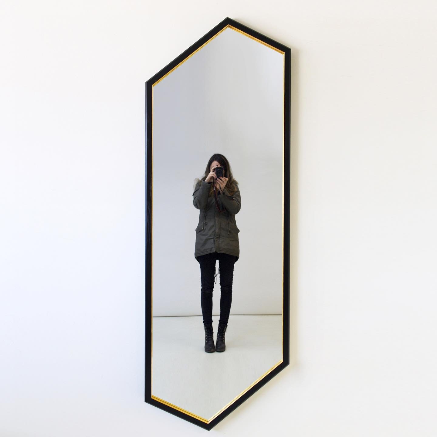 Introducing our Hex Full Length Mirror- an elongated version of our best seller. 😉 

Hex Full Length Mirror 
72&rdquo; x 25-1/4&rdquo; x 1-3/4&rdquo;
Solid Ebonized Ash  Chamfered Outside Edge 
Gilded 23-Karat Gold Detail 
Recessed Mirror Back

Cust