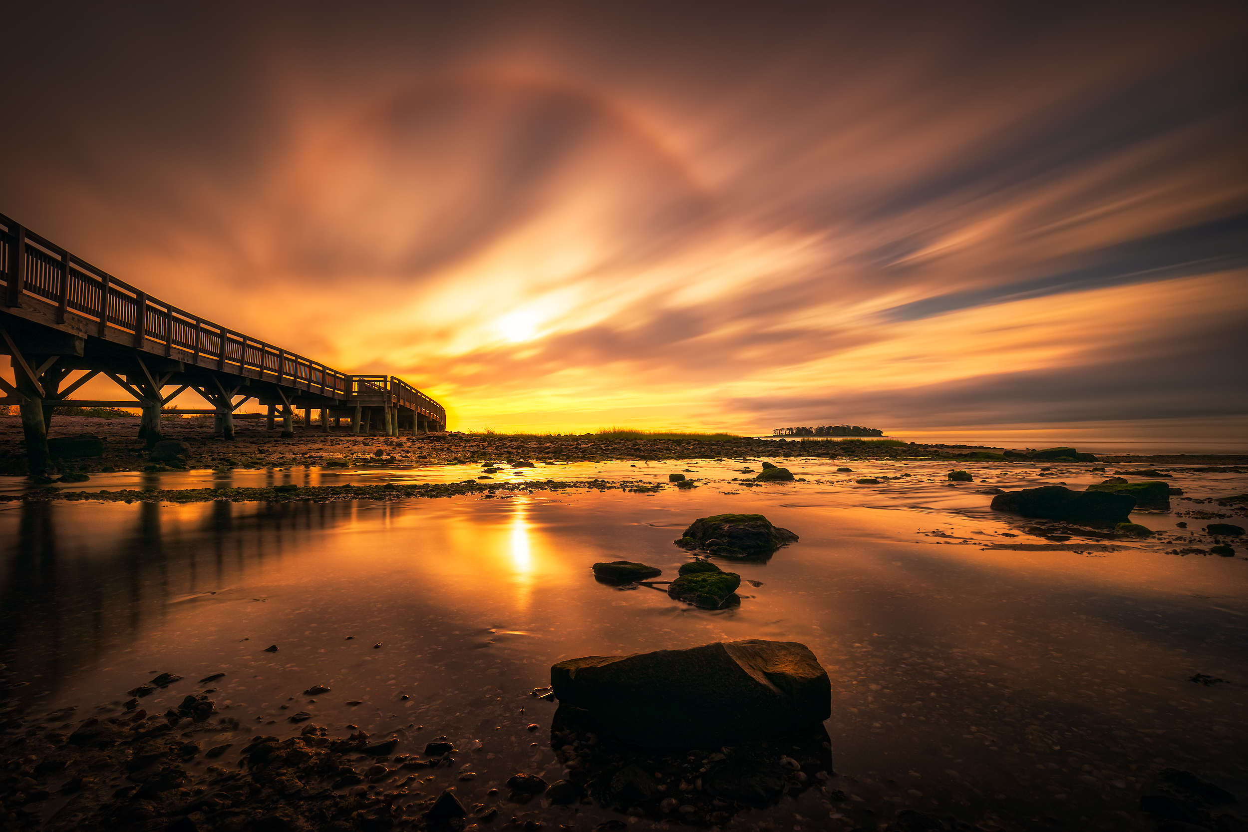  Long exposure Sunrise image taken by the Boardwalk at Silver Sands State Park in Milford, Connecticut, USA. 