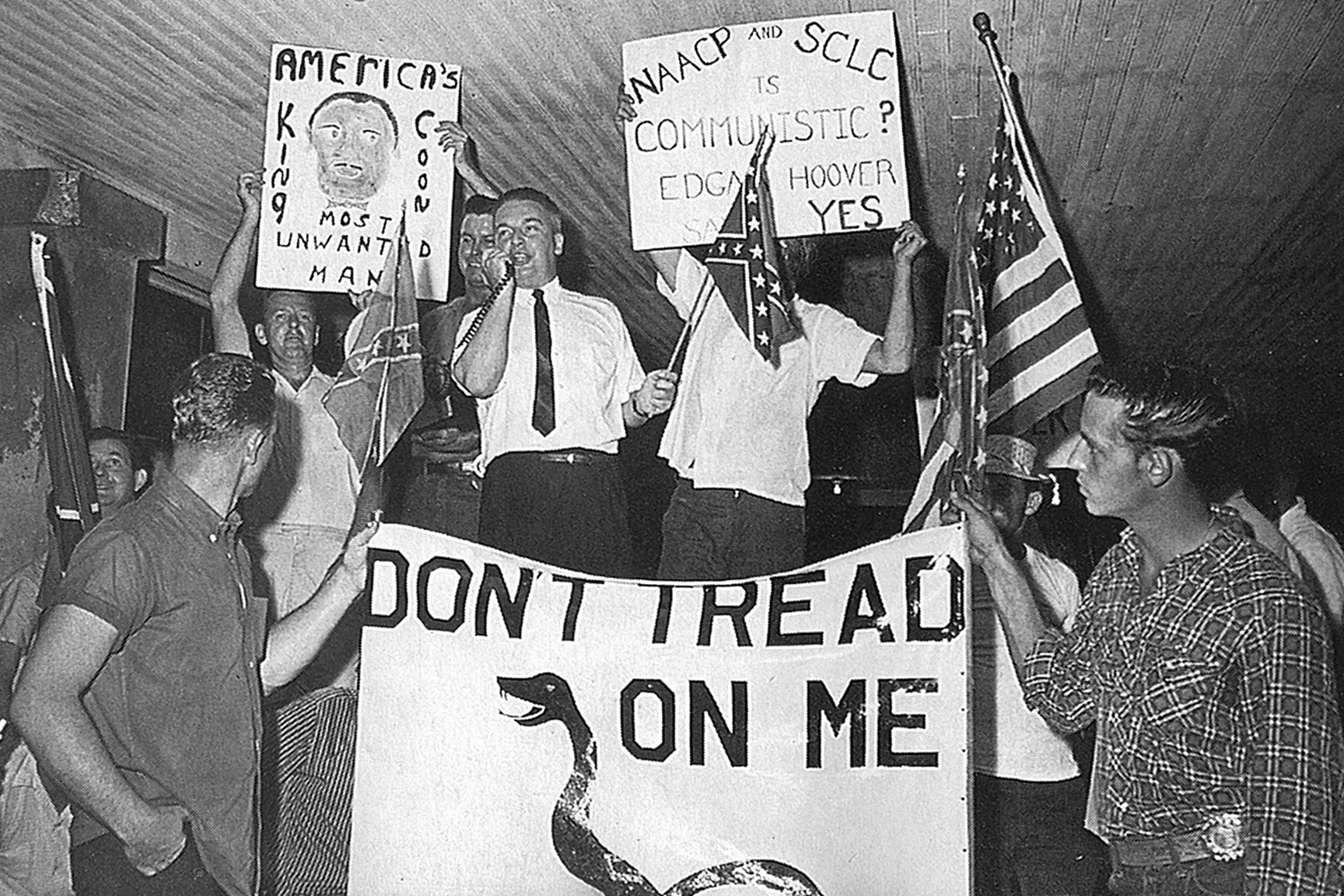White ant-integration protestors rally in the Old Slave Market in downtown St. Augustine.