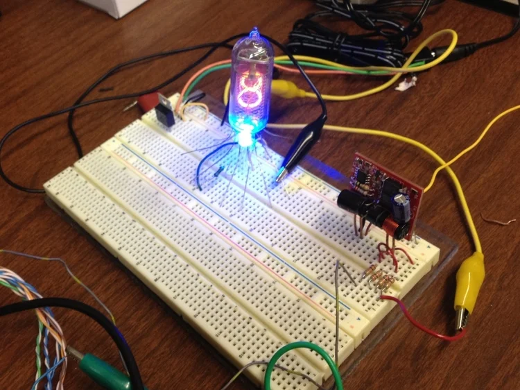 Testing a single IN-14 with an RGB LED. 180VDC tube power supply is provided by the red DC-DC converter board.