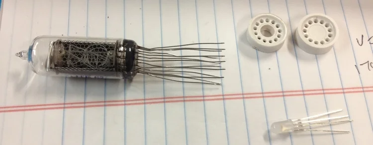 A hole was drilled in the plastic guard to allow the LEDs to be placed below each tube.