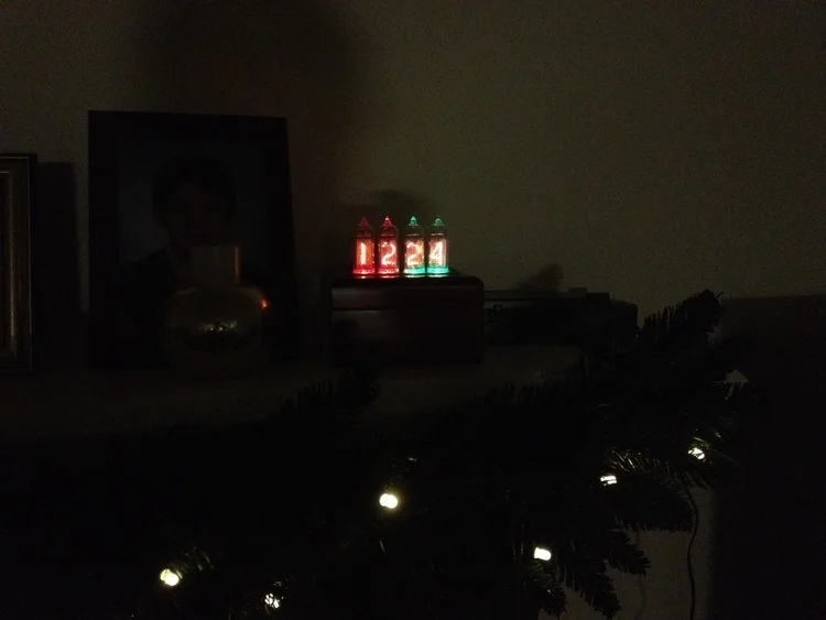 The clock can be set to alternate between the date & time. Here it is on the mantle on Christmas Eve.