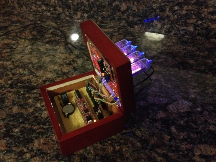 Clock opened, exposing the innards.