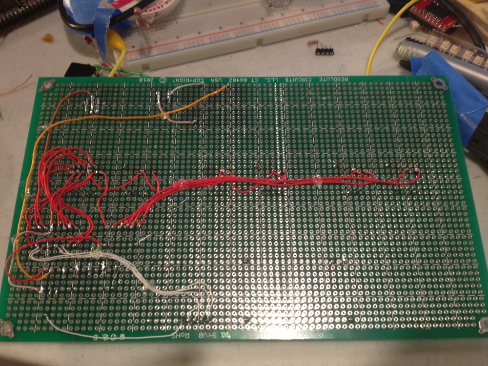 Partially-completed soldering on the underside of the protoboard.
