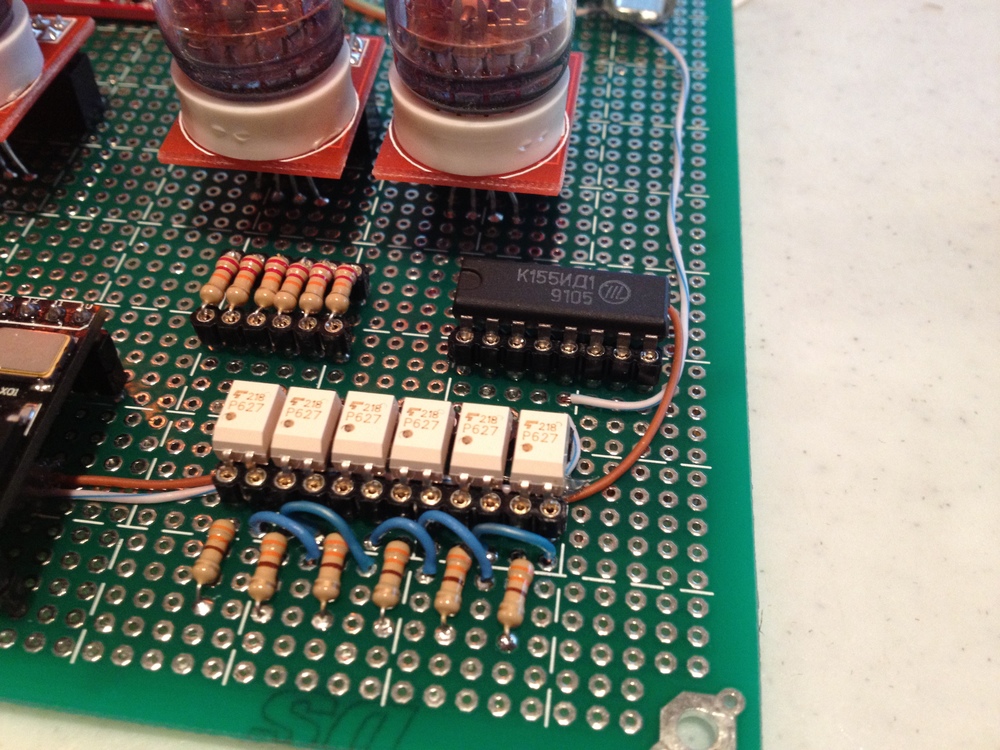 Detailed view of the TLP627 optoisolators and K155NA1 digit driver .