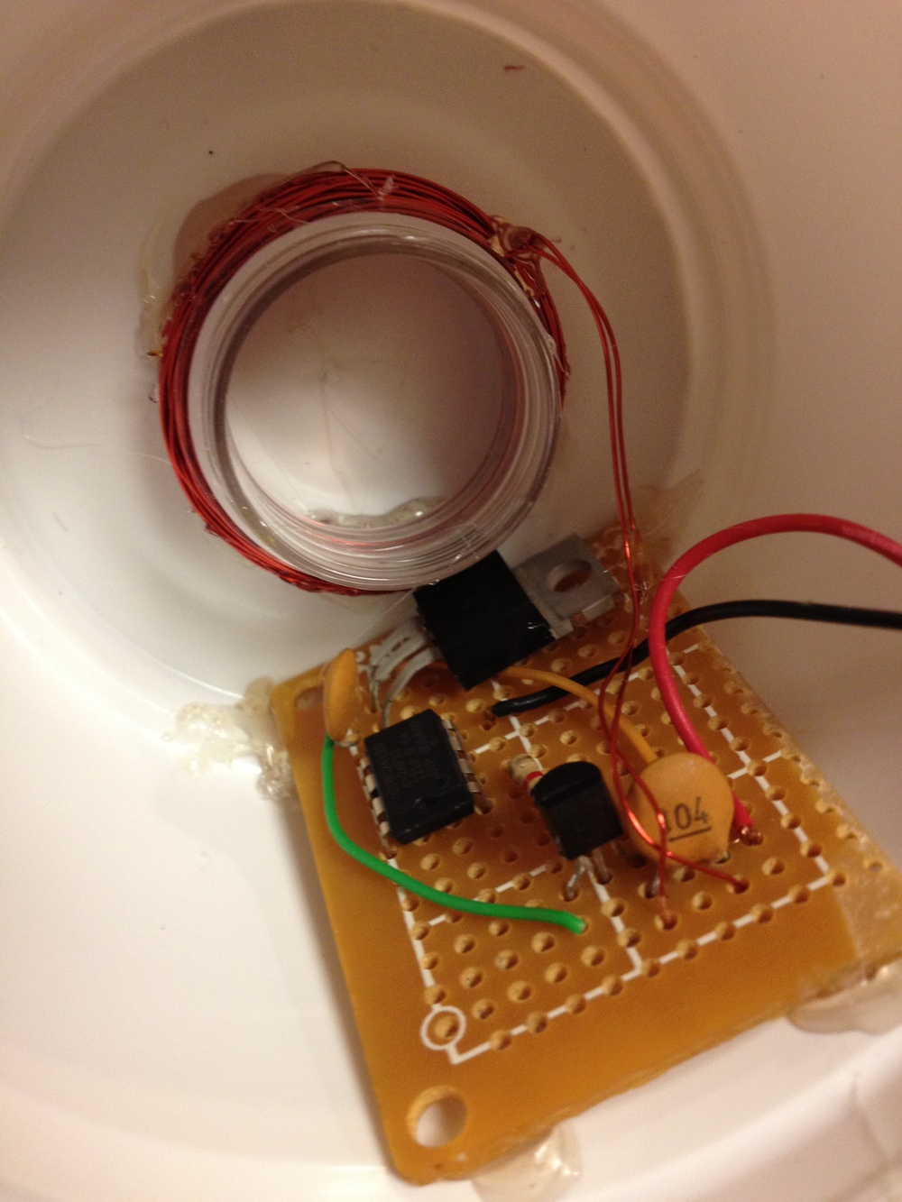 Wireless transmitter circuit beneath the base