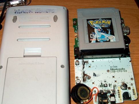 Reverse side of the TI-84 next to the GBC innards.