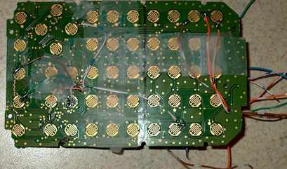 Keypad contact board from a broken TI-83, wired out to the GameBoy motherboard. 2nd → A ALPHA → B arrow keys → DPAD enter → start + key → select