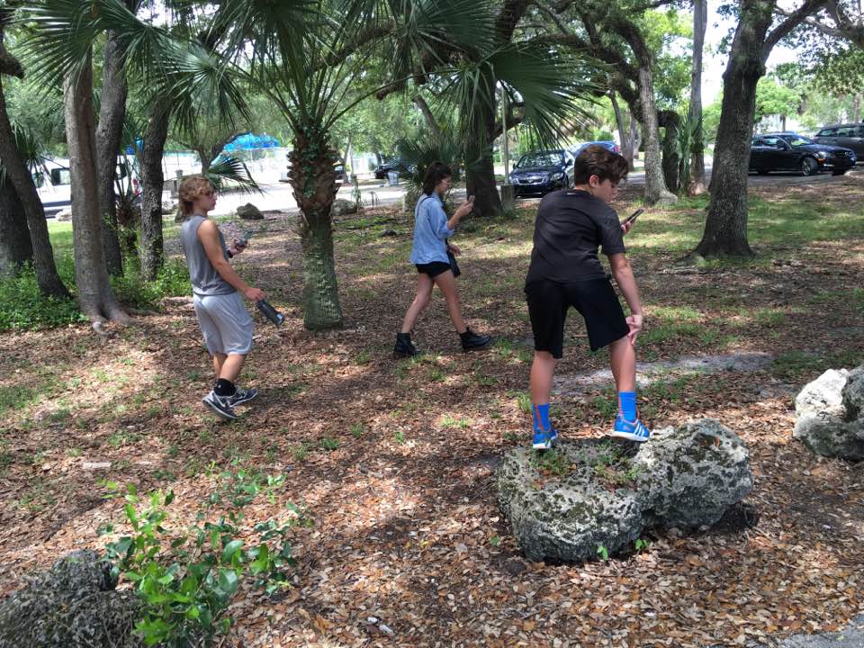 My not-so-little siblings shamelessly hunting Pokemon in the jungles of Miami.