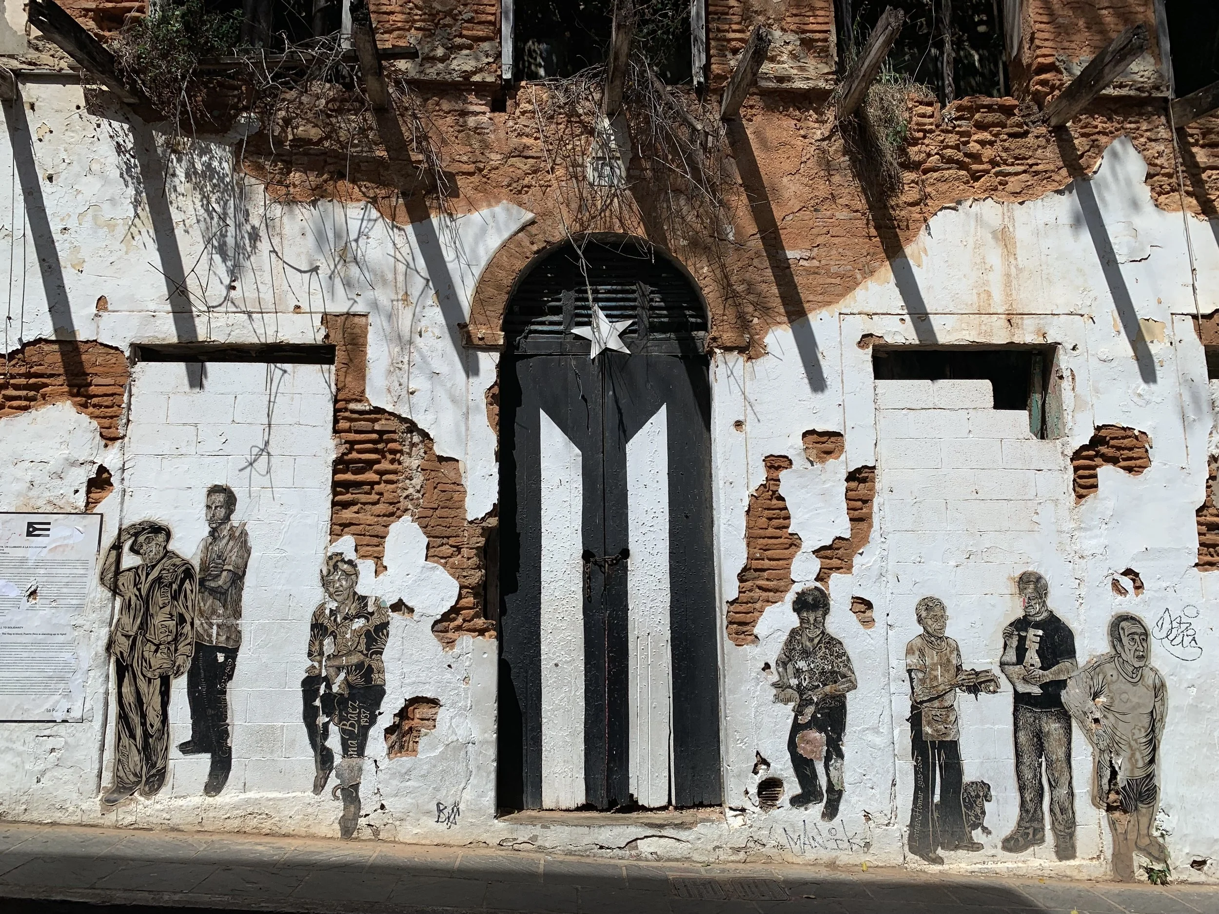 La Puerta de la Bandera, which is now painted in black and white in solidarity of the fight for social, economic and political progress in Puerto Rico.