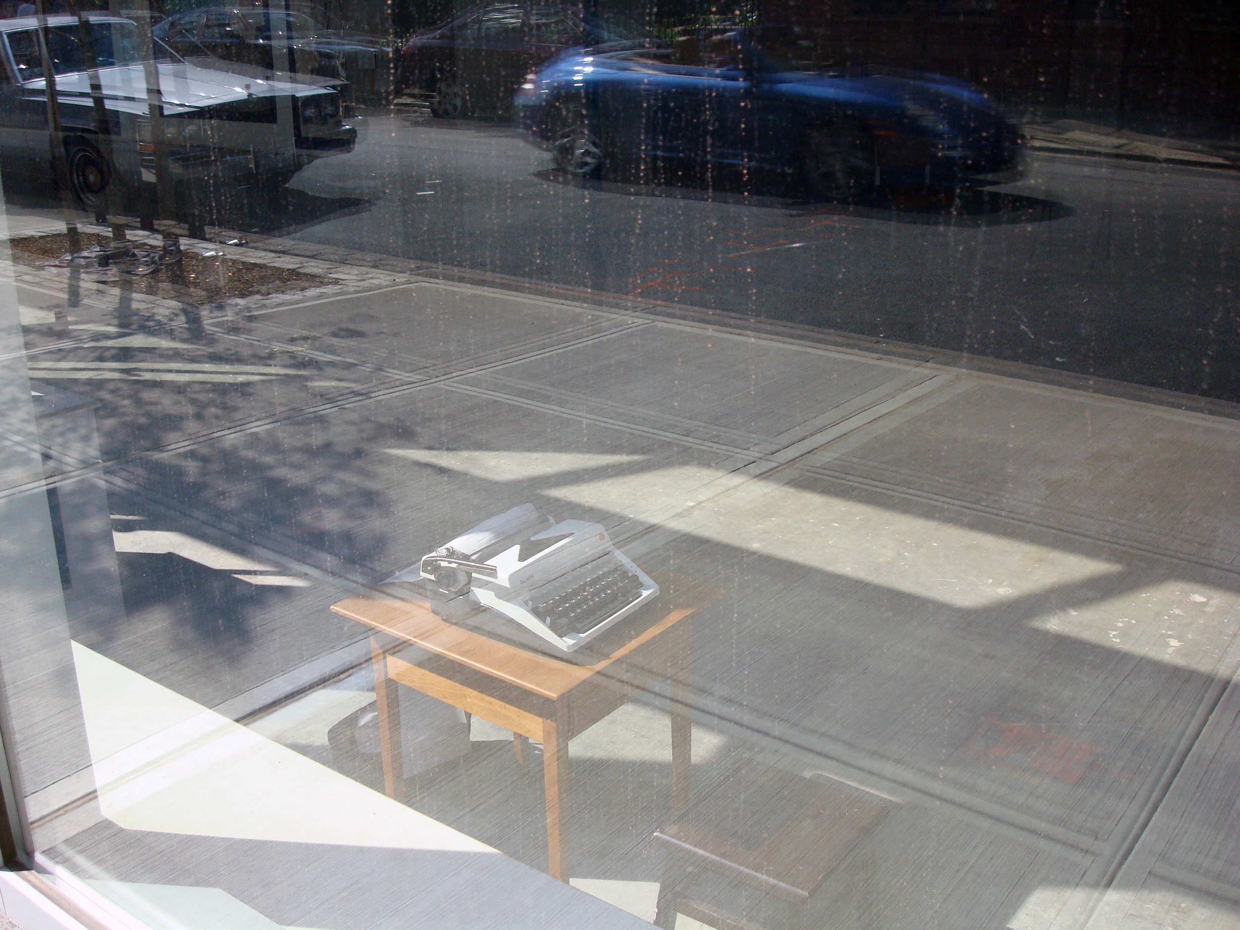   Little Stories of Collective Sub-Deams ,&nbsp;2009-20_  typewriter + wood table &amp; chair + paper,&nbsp;variable dimensions 