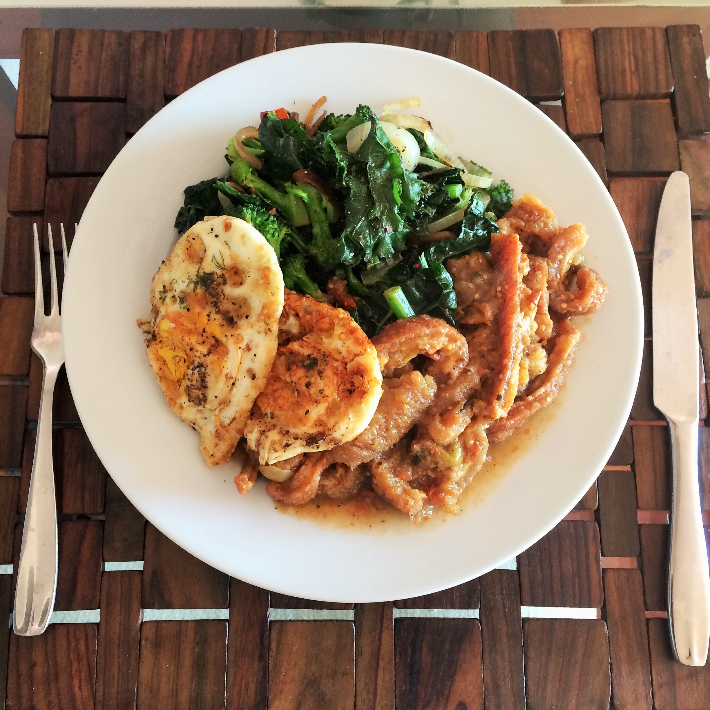 Braised Pork Rinds with Kale and Fried Eggs