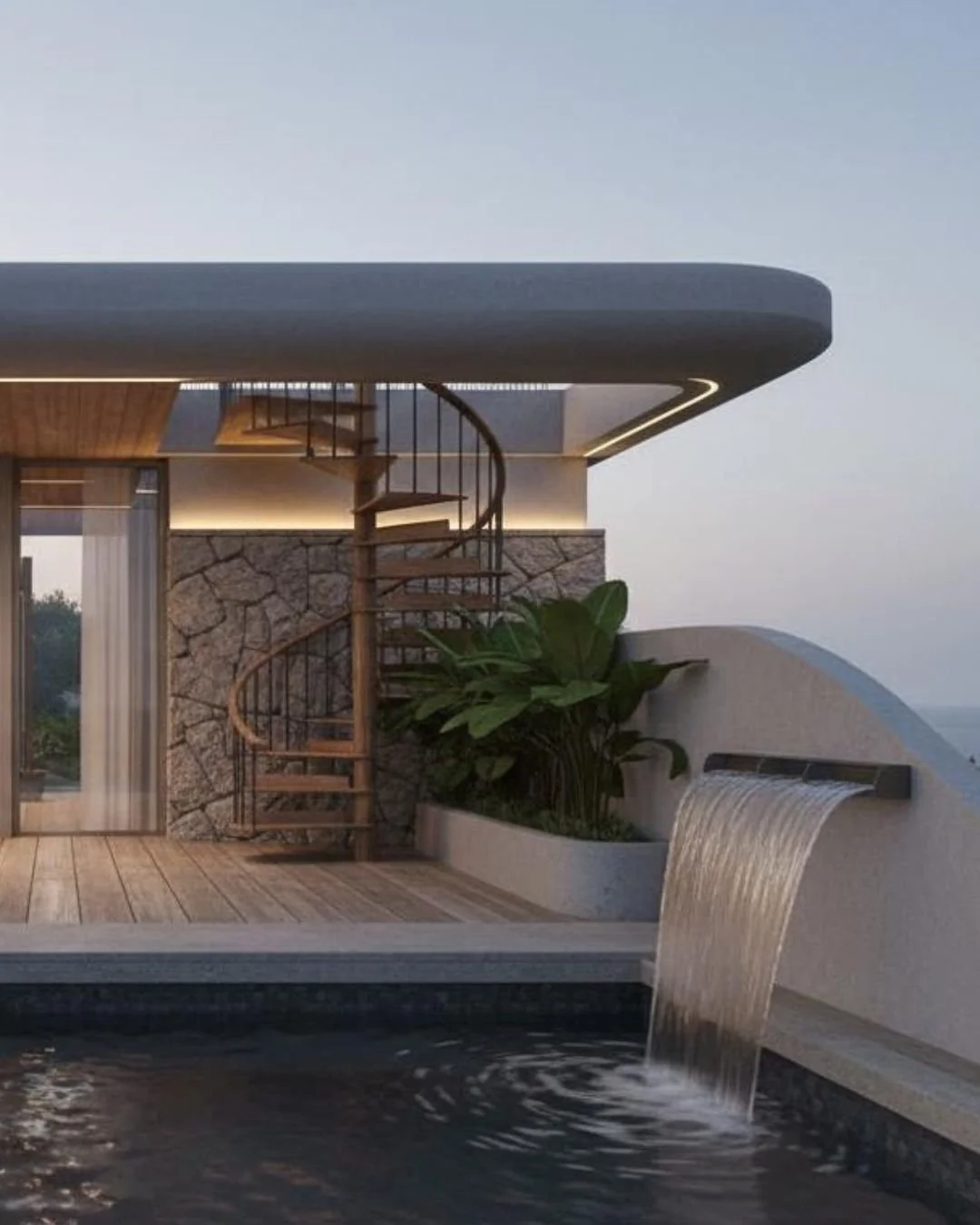 Modern rooftop with a waterfall feature, spiral wooden staircase, large green plants, and a stone wall, overlooking a scenic landscape at dusk.