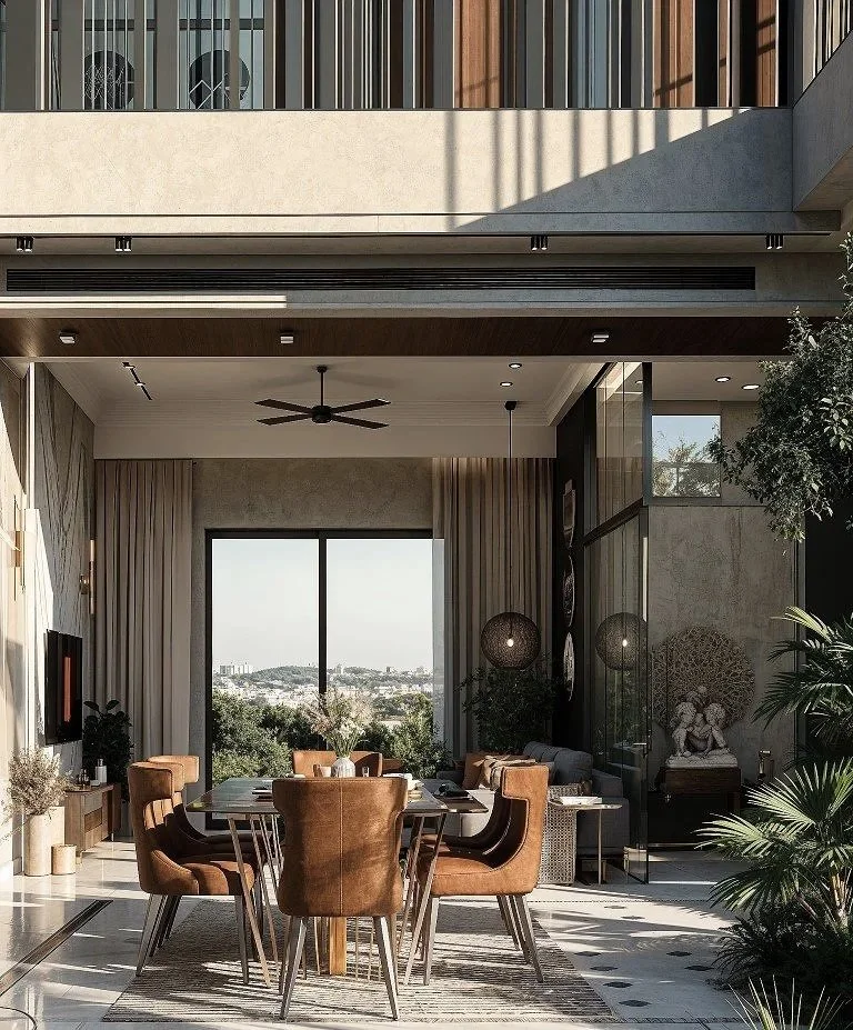 Modern living room with large window, wooden dining table, six brown chairs, indoor plants, artwork, and decorative statues.
