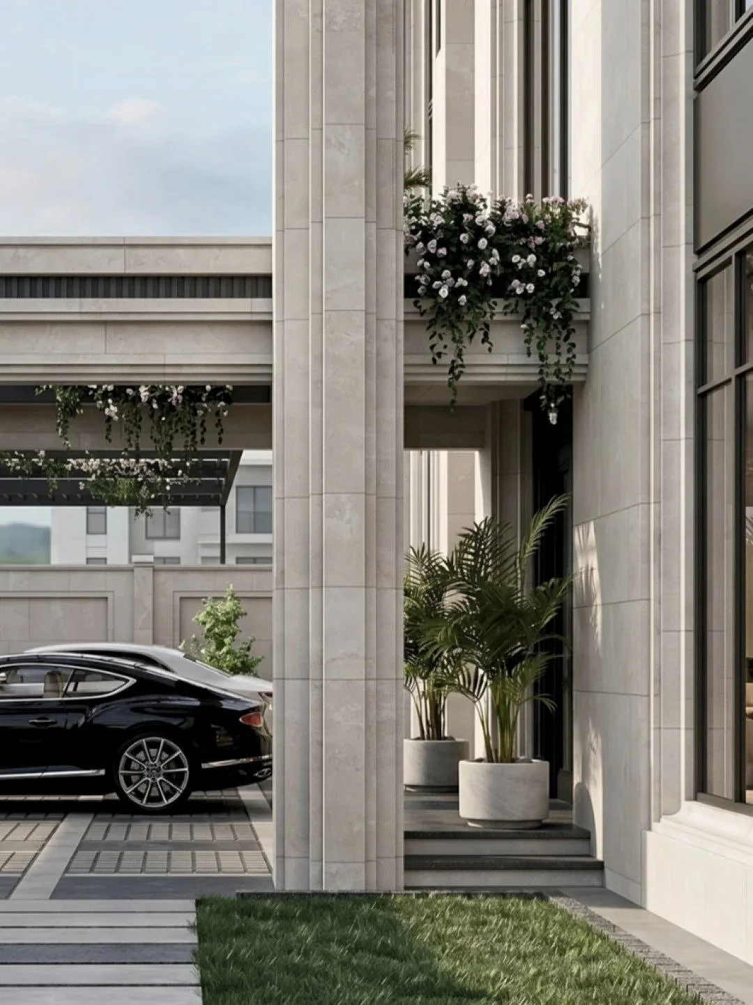 Exterior view of a modern building with large windows, potted plants by the entrance, a black luxury car parked nearby, and decorative flowers in a planter box.