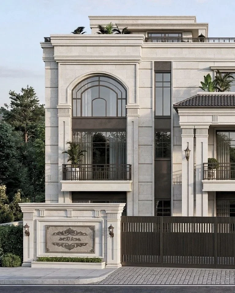 front view of an elegant multi-story mansion with large arched windows, balconies with potted plants, and decorative stonework, surrounded by trees and a gated entrance.