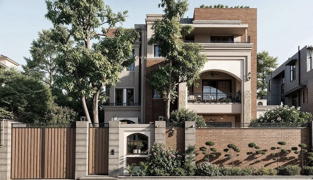 Multi-story modern house with a red brick and beige facade, arched and rectangular windows, balcony with black railings, large trees in front, and a brick and wood fence with greenery along the sidewalk.