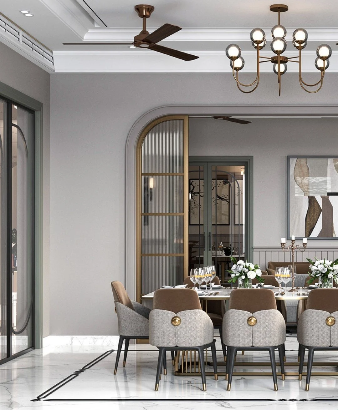 Elegant dining room with a large table set with wine glasses and floral centerpieces, beige and gray chairs, modern chandelier, ceiling fans, glass doors, and framed artwork on the wall.