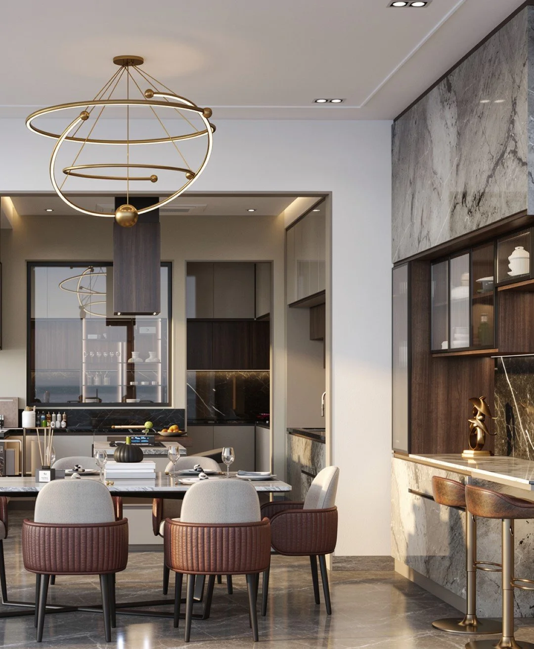Modern kitchen and dining area with a circular crystal chandelier, beige and brown upholstered chairs, a black marble table set with glasses and dinnerware, and sleek beige cabinetry.