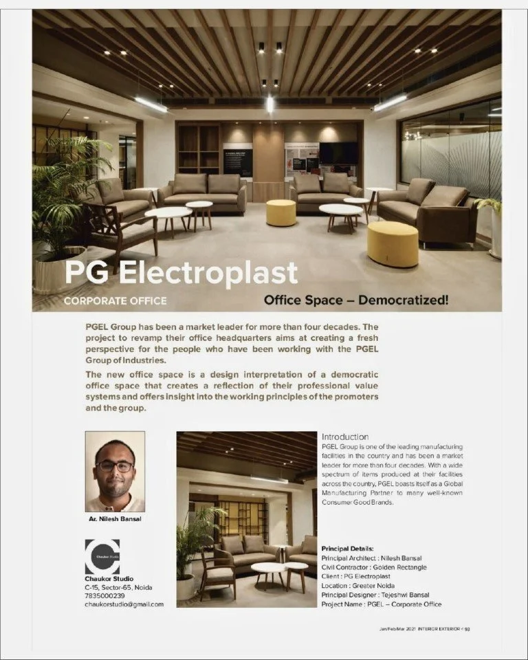 Modern corporate office lounge with beige sofas, coffee tables, indoor plants, and wood accents, highlighting PG Electroplat's office space.