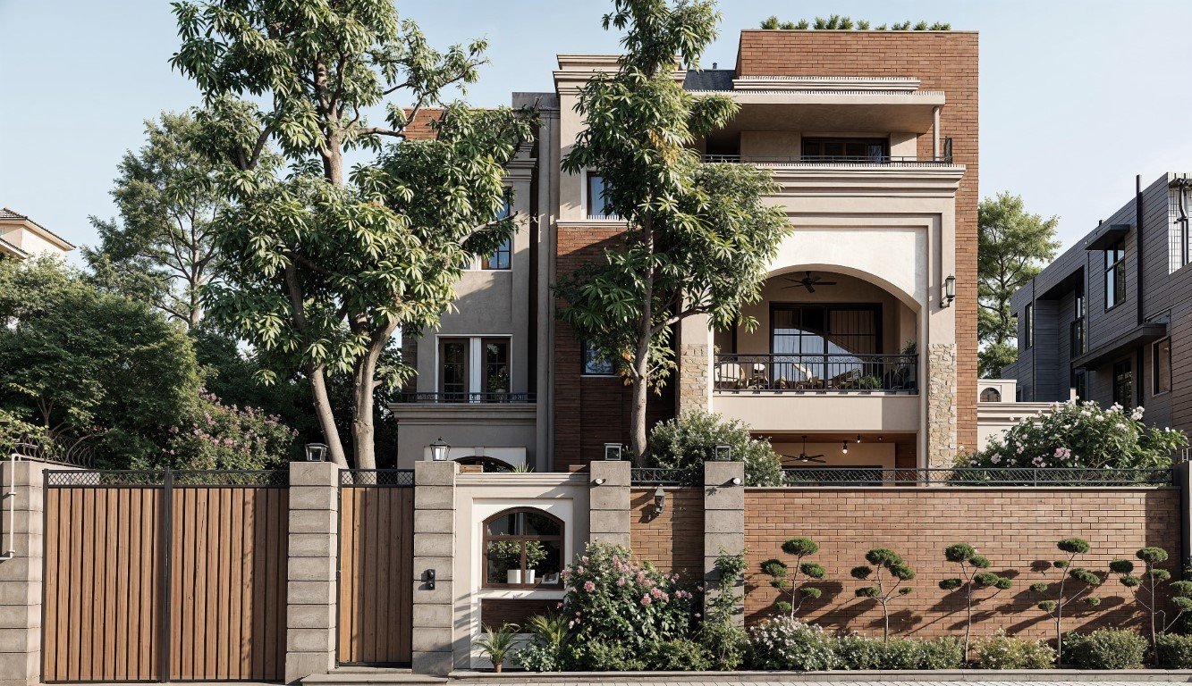 Multi-story modern house with a red brick and beige facade, arched and rectangular windows, balcony with black railings, large trees in front, and a brick and wood fence with greenery along the sidewalk.