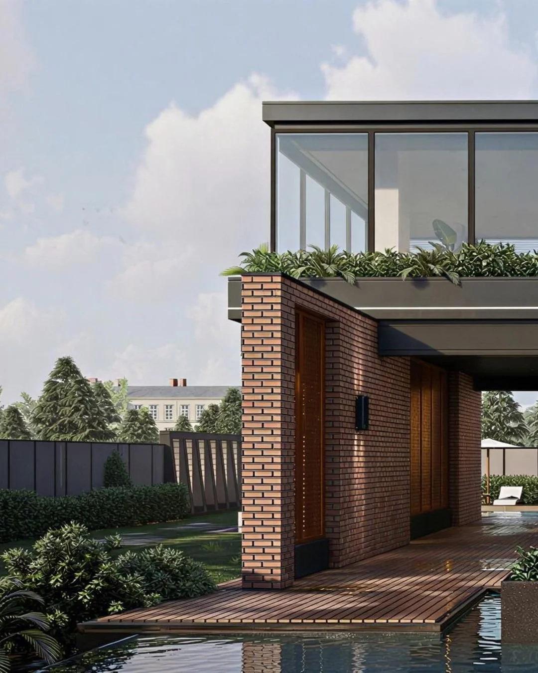 Modern house with brick exterior, wooden accents, glass balcony, and a pool in the foreground, surrounded by greenery and trees under a partly cloudy sky.