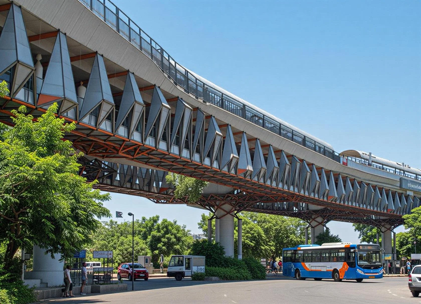 City bus in front of elevated train station with modern angular architecture, green trees, and people at bus stop on a sunny day.