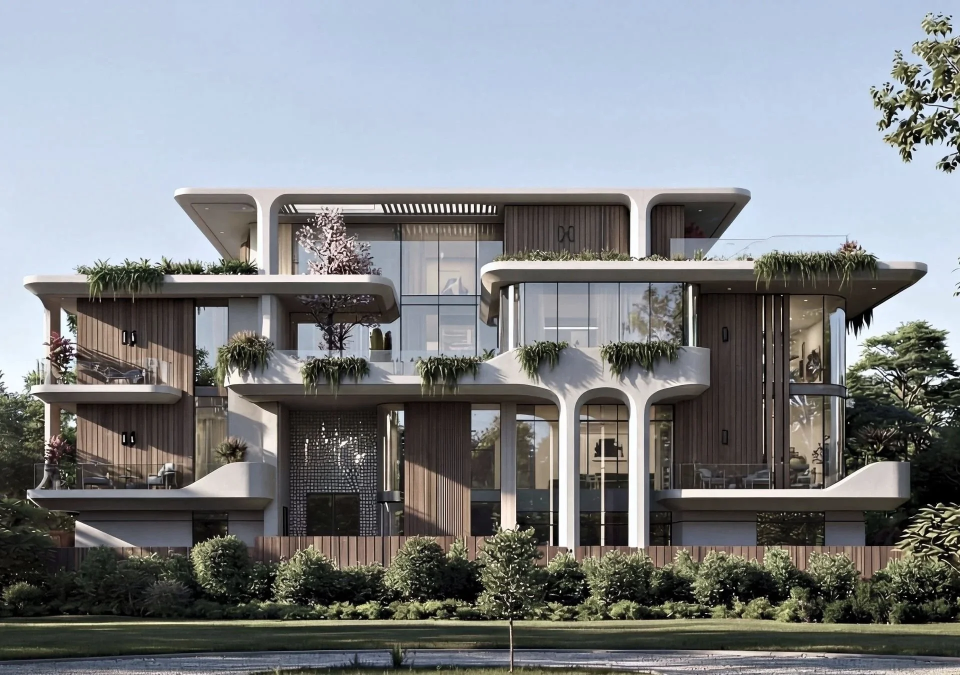 Modern multi-story residential building with curved white balconies, wooden accents, large glass windows, and greenery on the terraces, set against a clear blue sky and surrounded by trees.