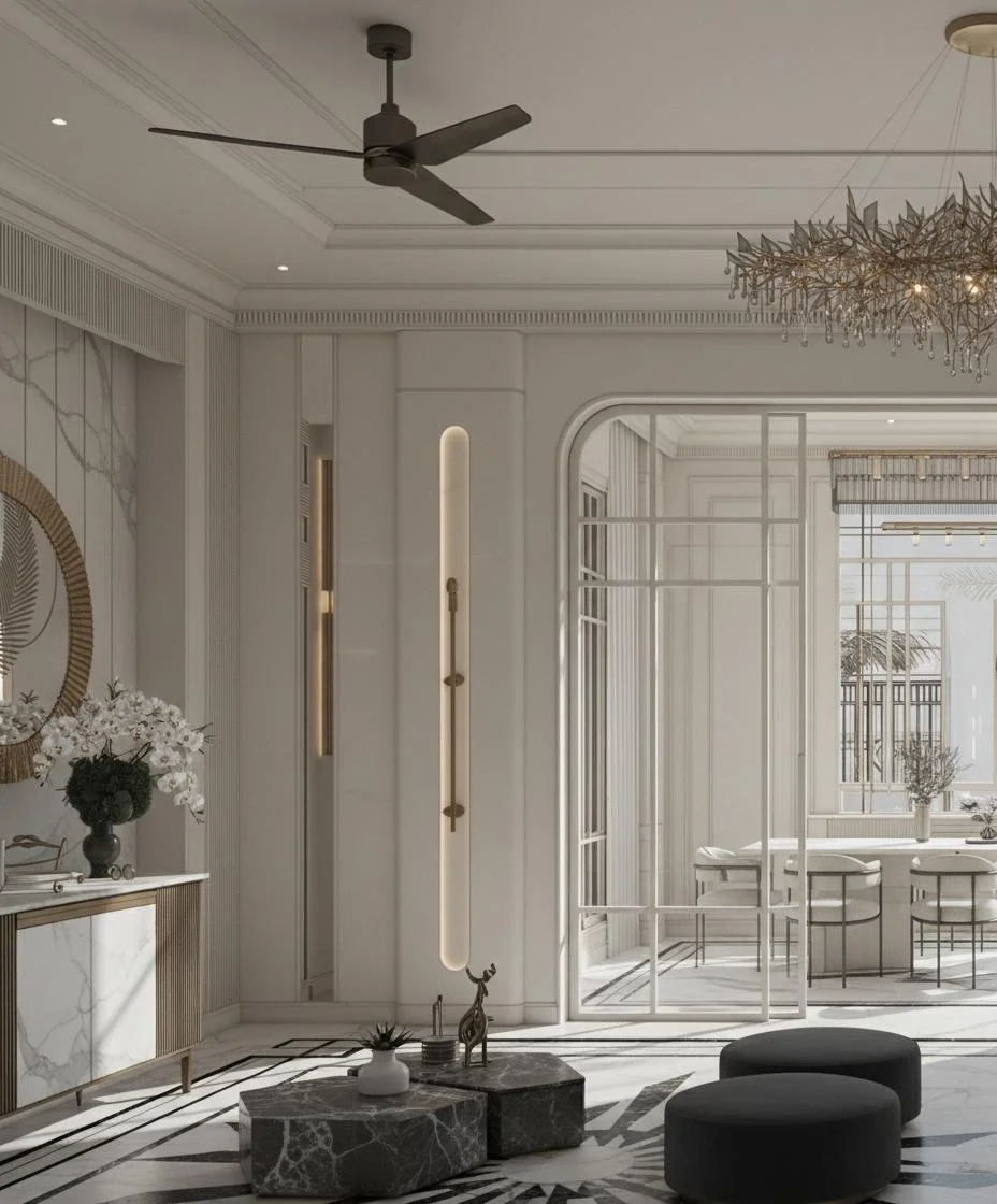 Modern, elegant living room with white walls, ceiling fan, decorative lighting, black and white marble floors, and minimalistic black ottomans.