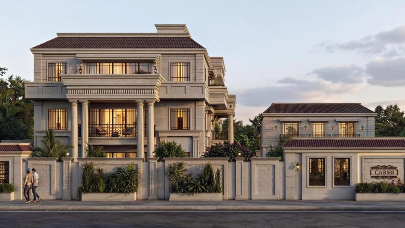 A luxurious multi-story building with classical architectural features, including columns and ornate details, surrounded by a high wall with lush greenery, in a well-maintained neighborhood, during dusk.