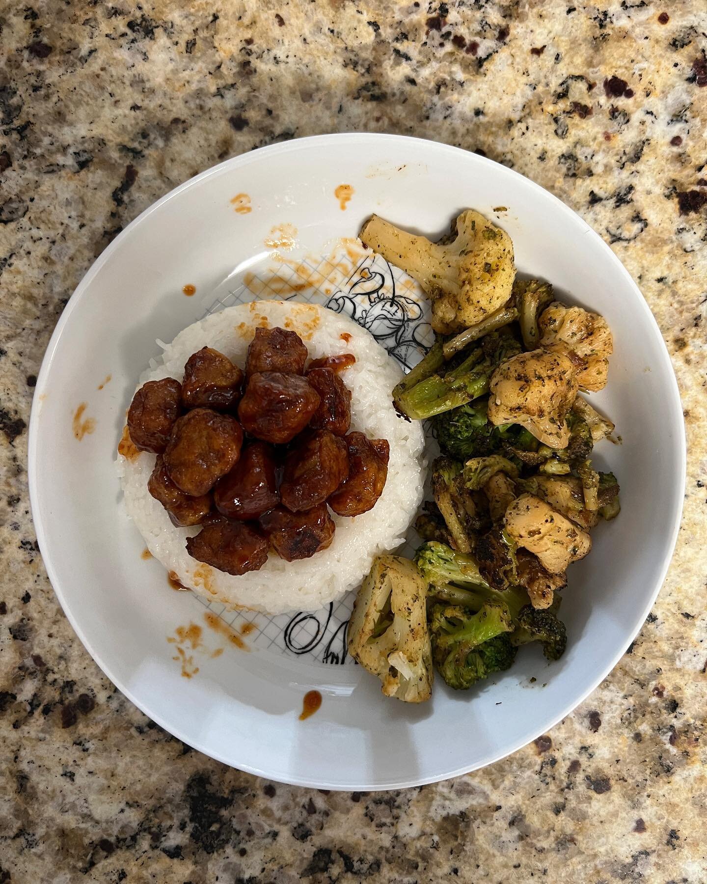 Sweet and sour porkless bites over sticky white rice with a side of roasted broccoli and cauliflower!