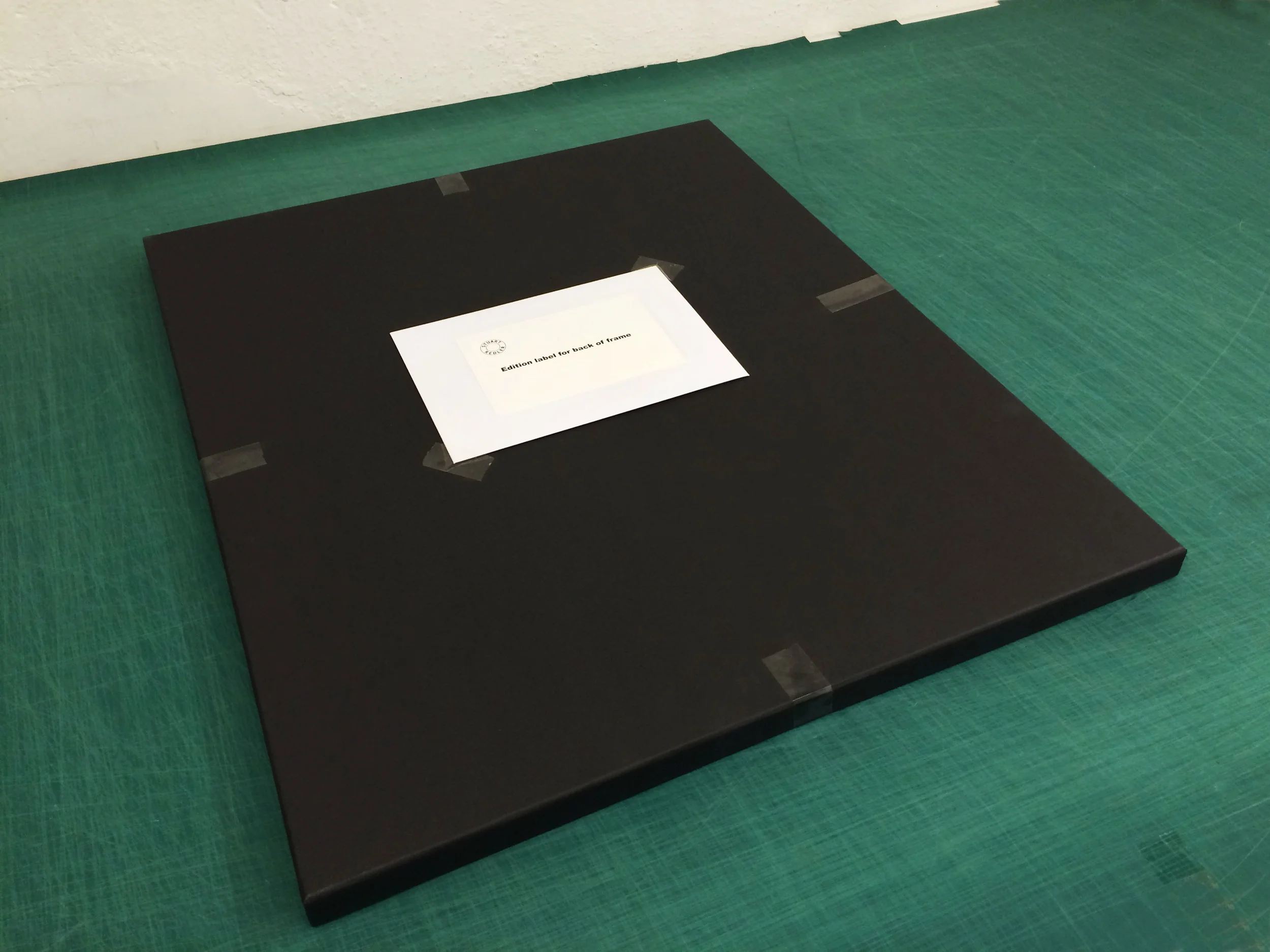 Sealed print box with edition label in envelope taped to box.