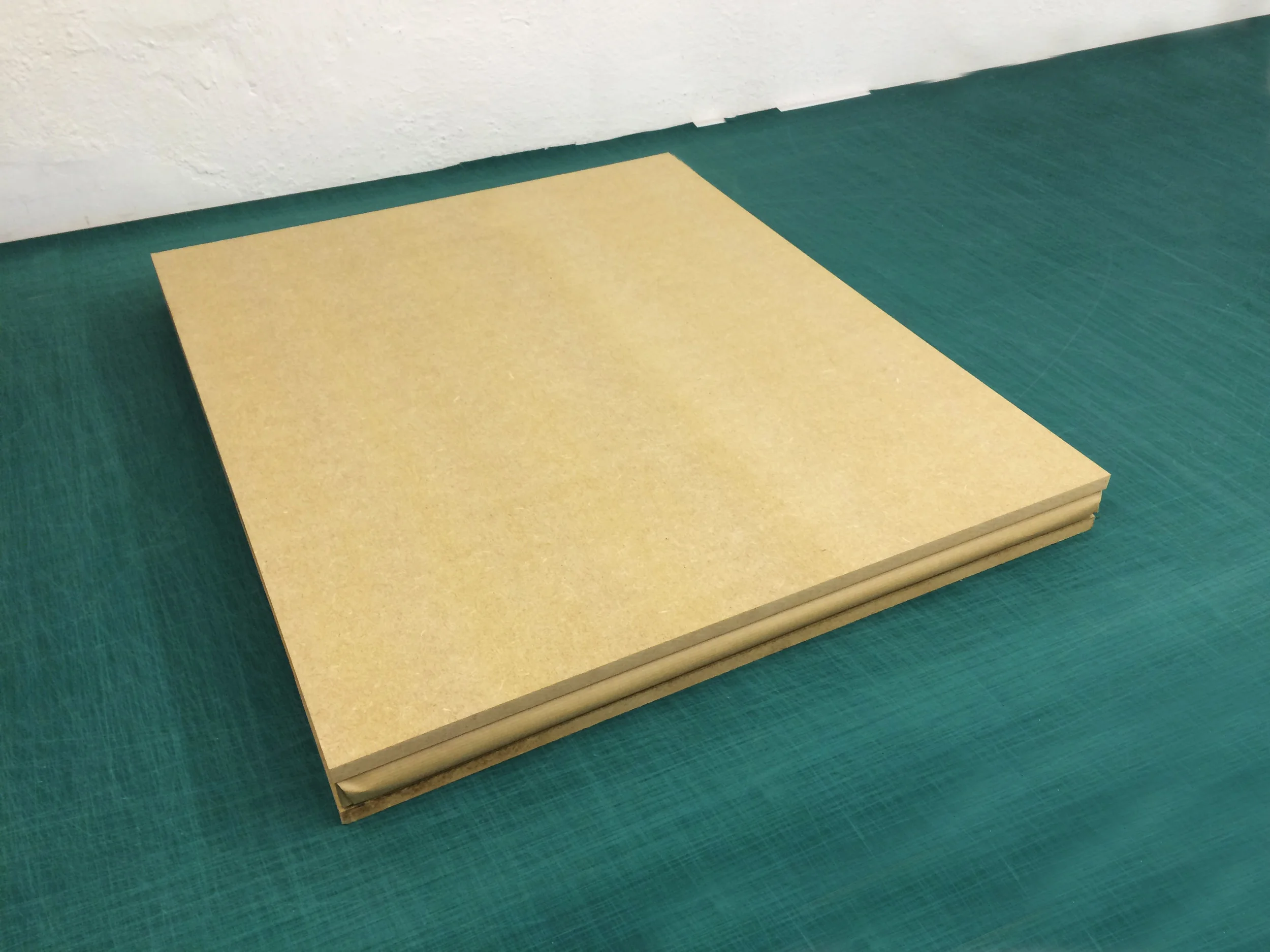 Print box sandwiched between two 12mm/0.5 inch sheets of MDF/wood.