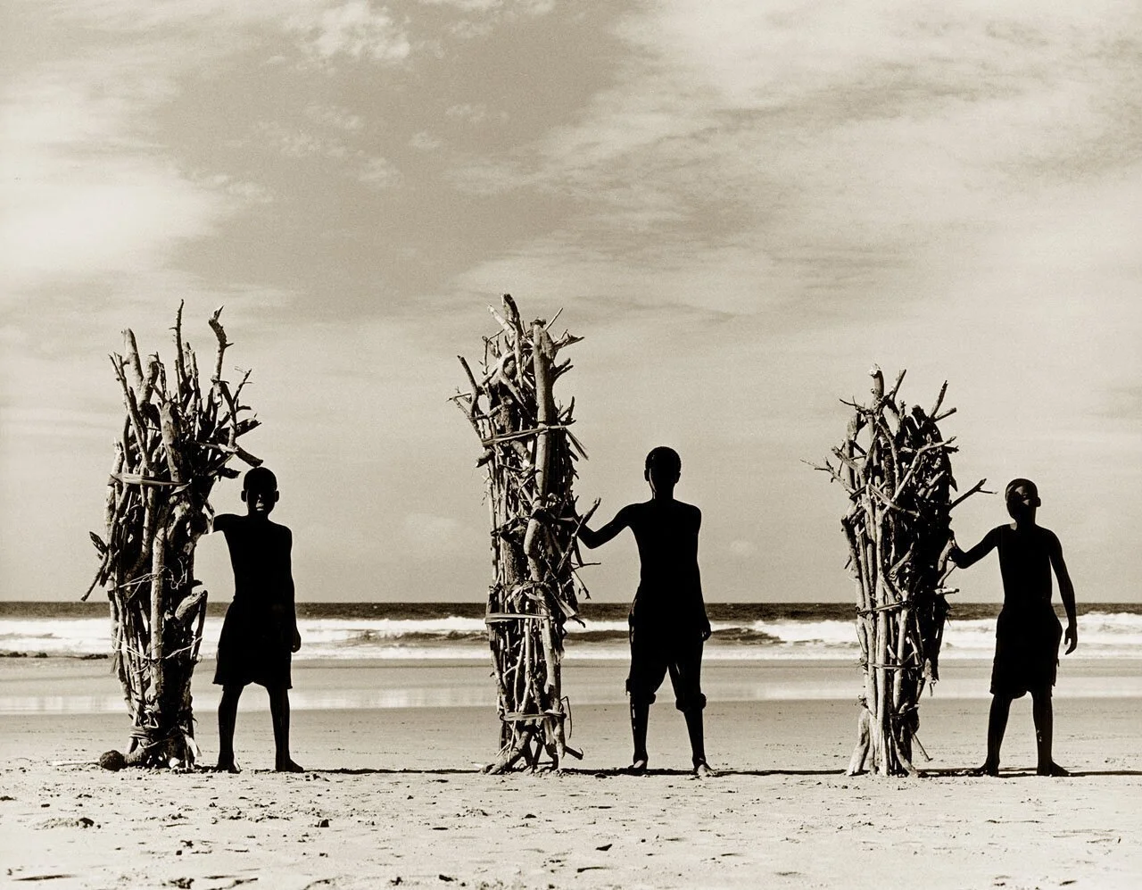Three Surfers