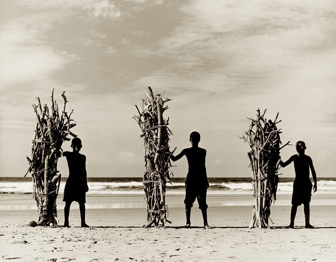 Three Surfers