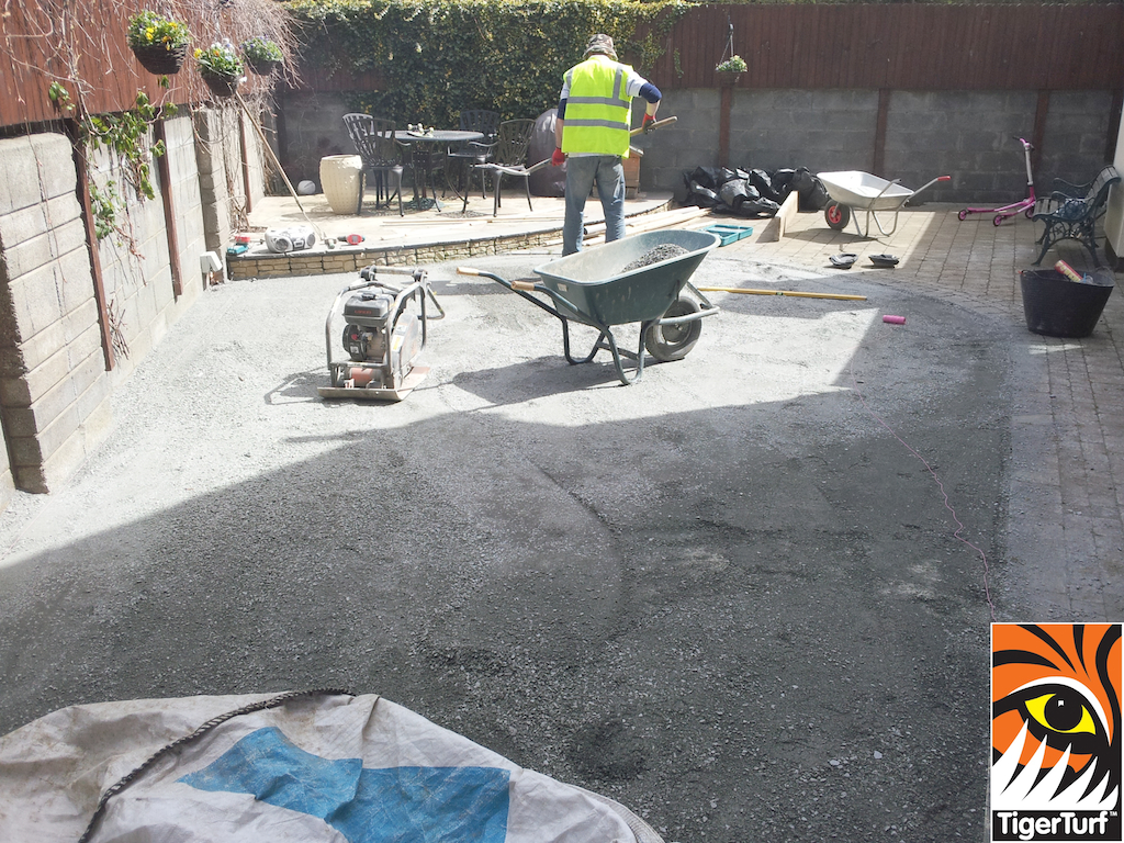 Installers preparing groundwork for grass