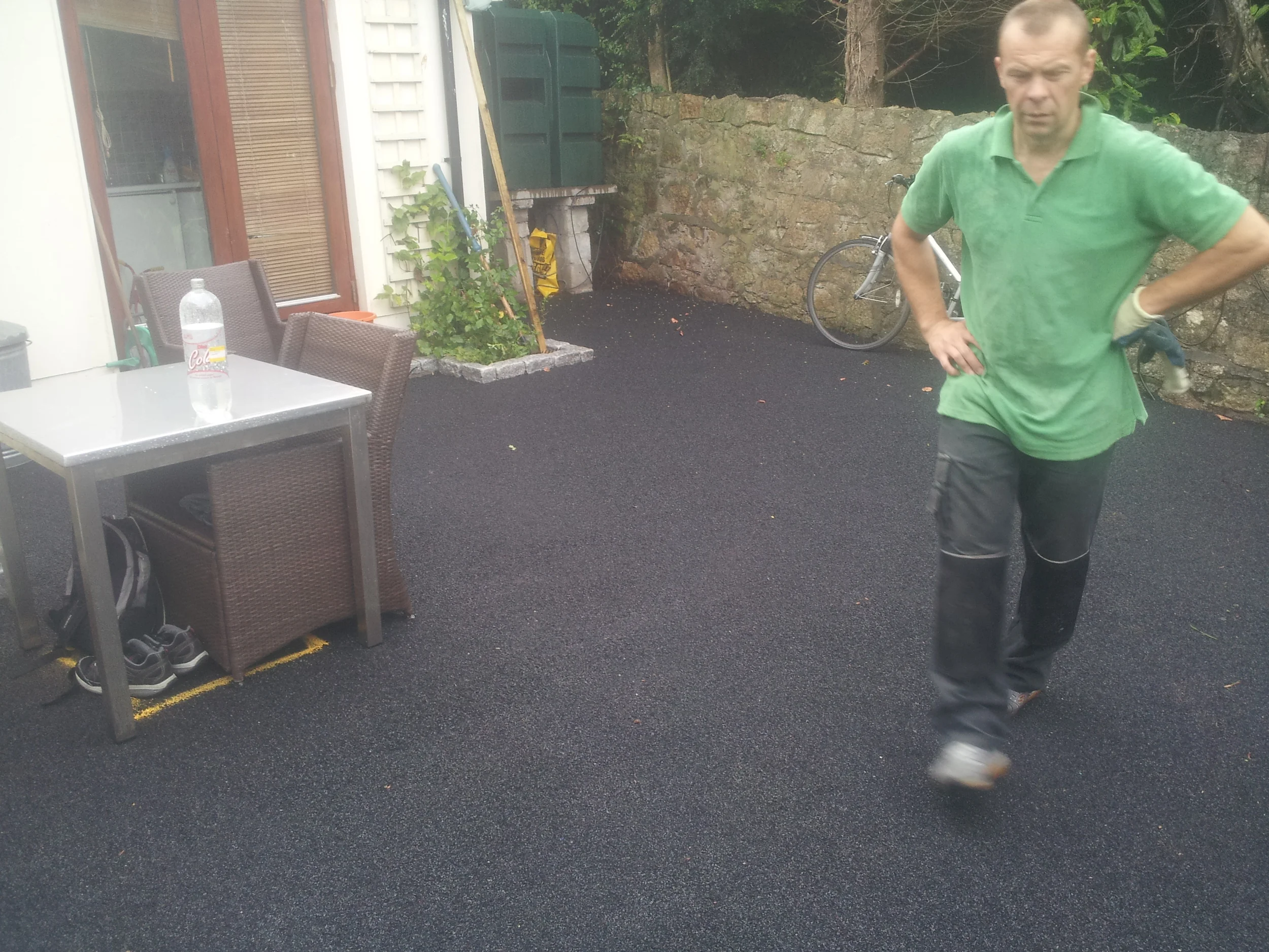 installer inspecting shock pad