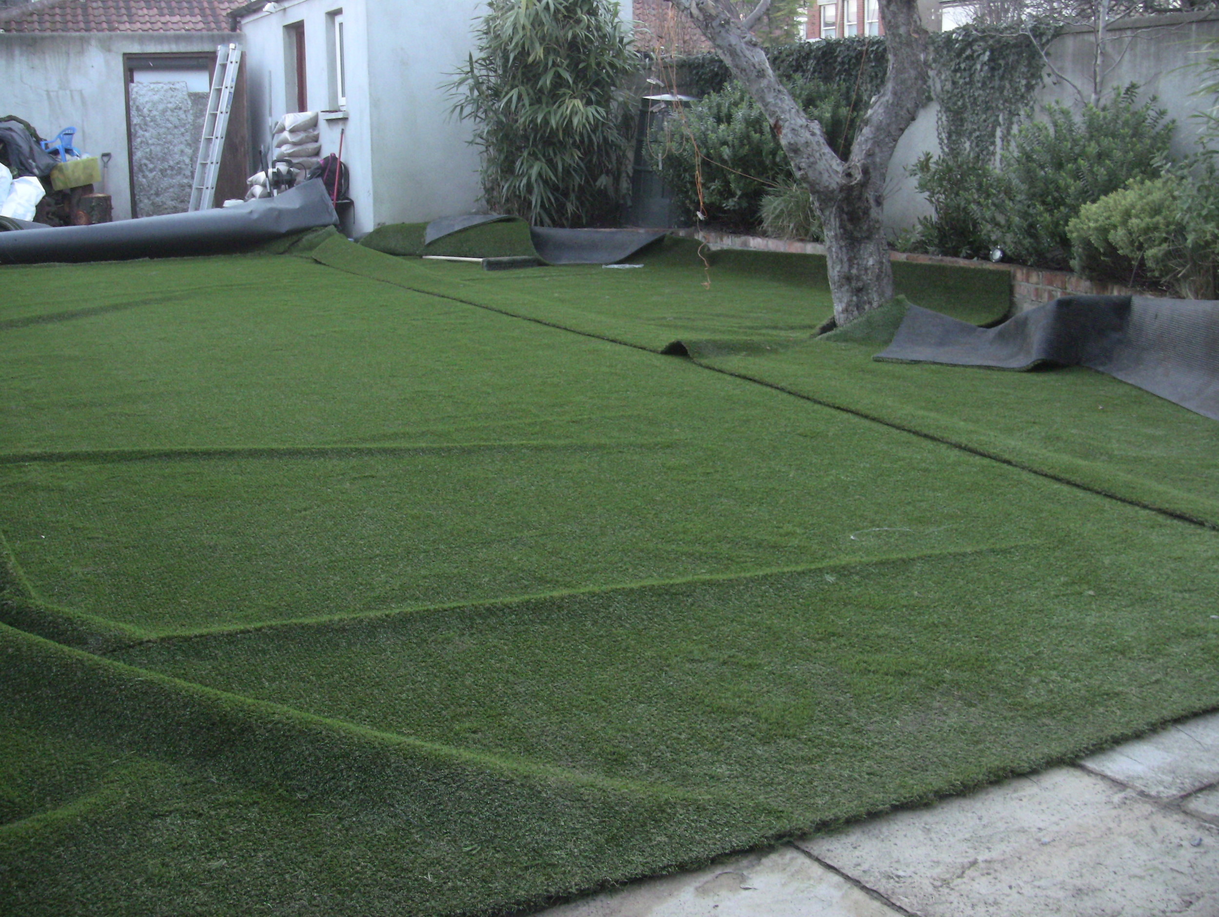 cutting turf into shape of lawn 