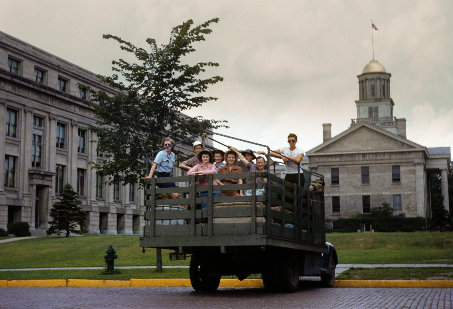 Iowa Mountaineers members pose for a photo on the UI Pentacrest before embarking on a 5,000 mile round-trip drive to Alaska in 1950.