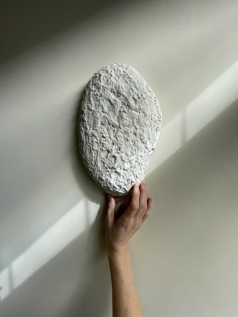 STONES &bull;
Inspired by the way rain slowly erodes stone, softening its surface over time. Each mark echoes a process of quiet transformation, where repetition and patience leave their subtle imprint.

Available in three shapes. Sizes; small 19 x 3