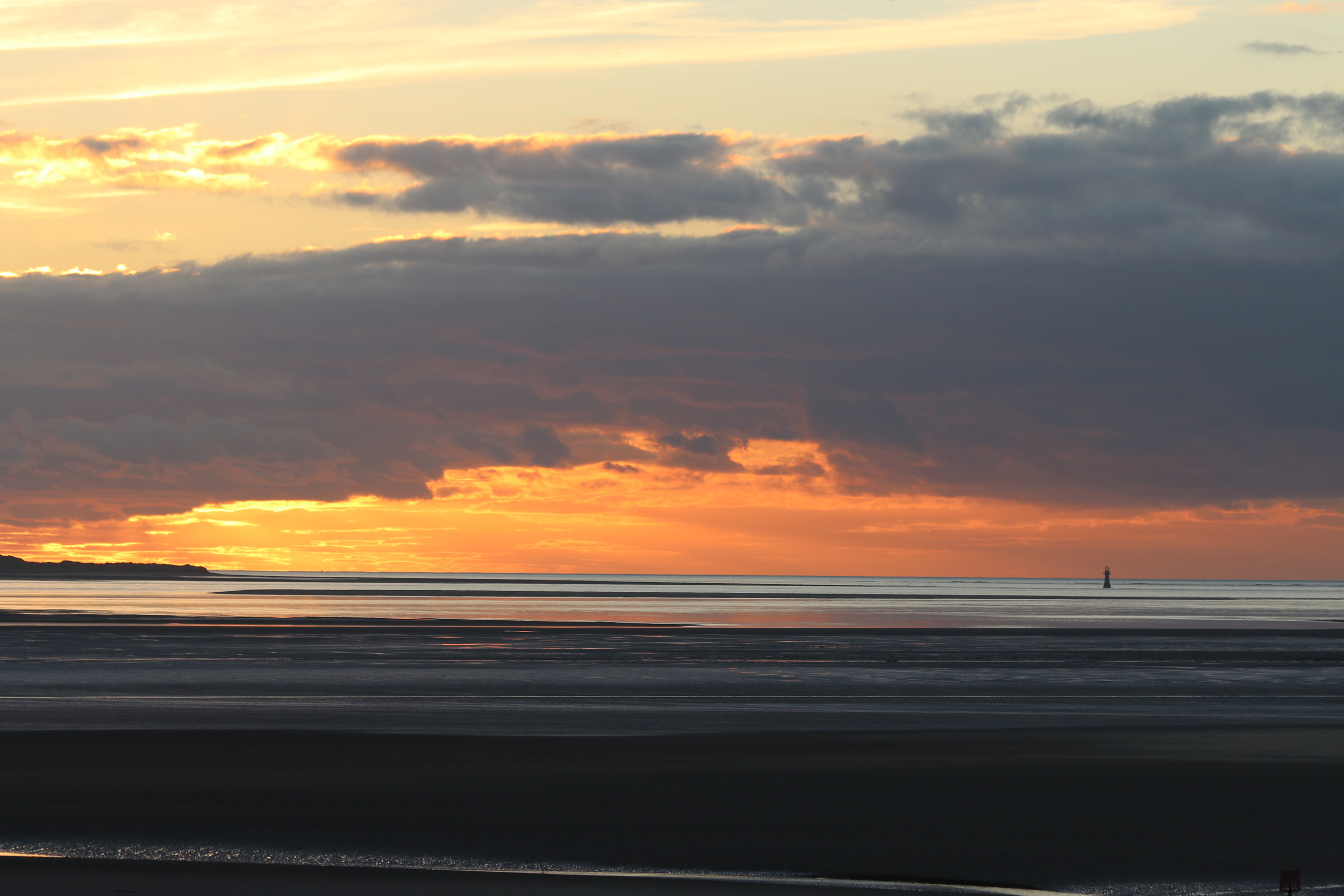 Whiteford Point Lighthouse: viewed at sunset from Llanelli beach.