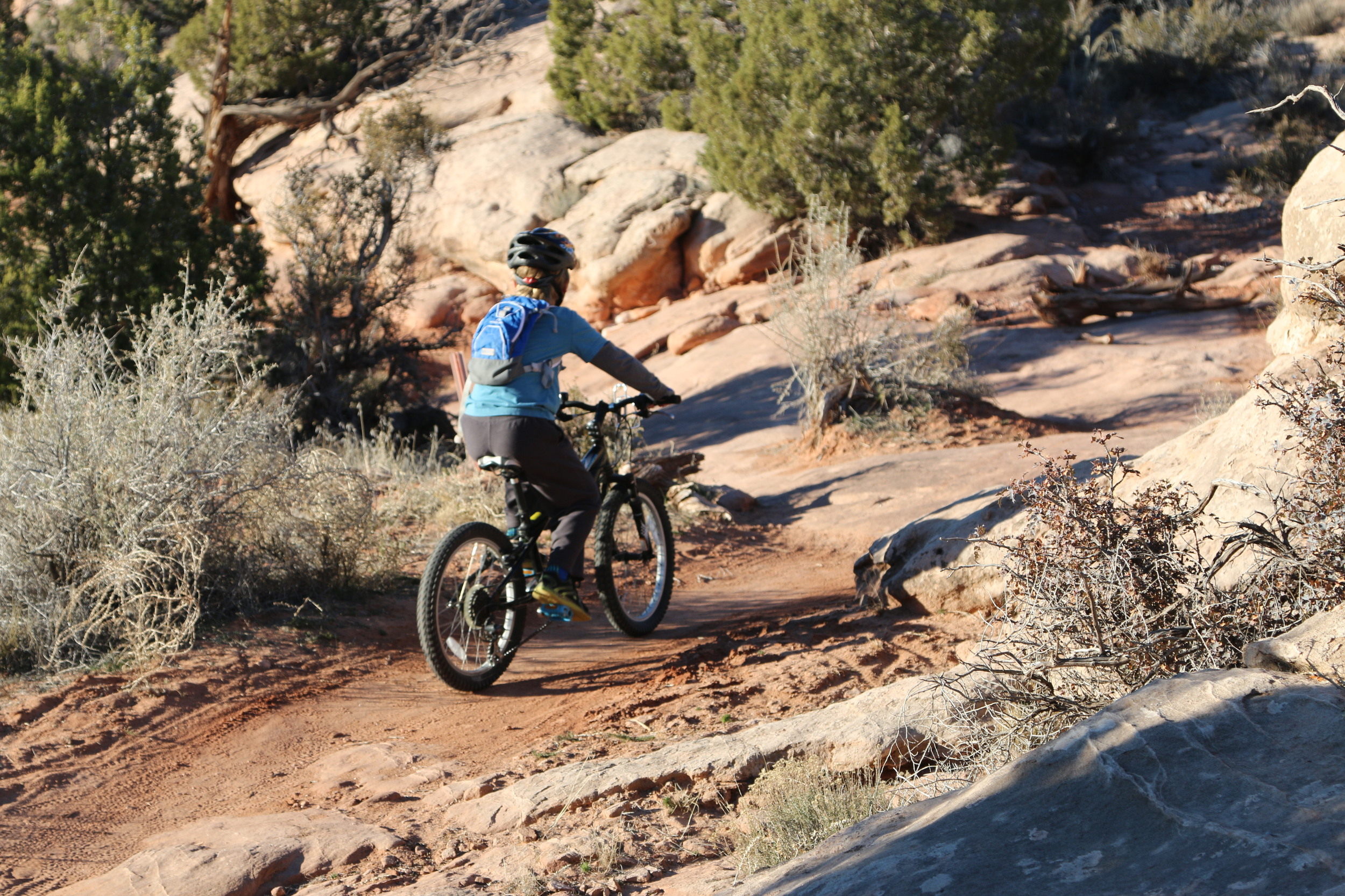 Moab: Dylan mountain biking on single track.