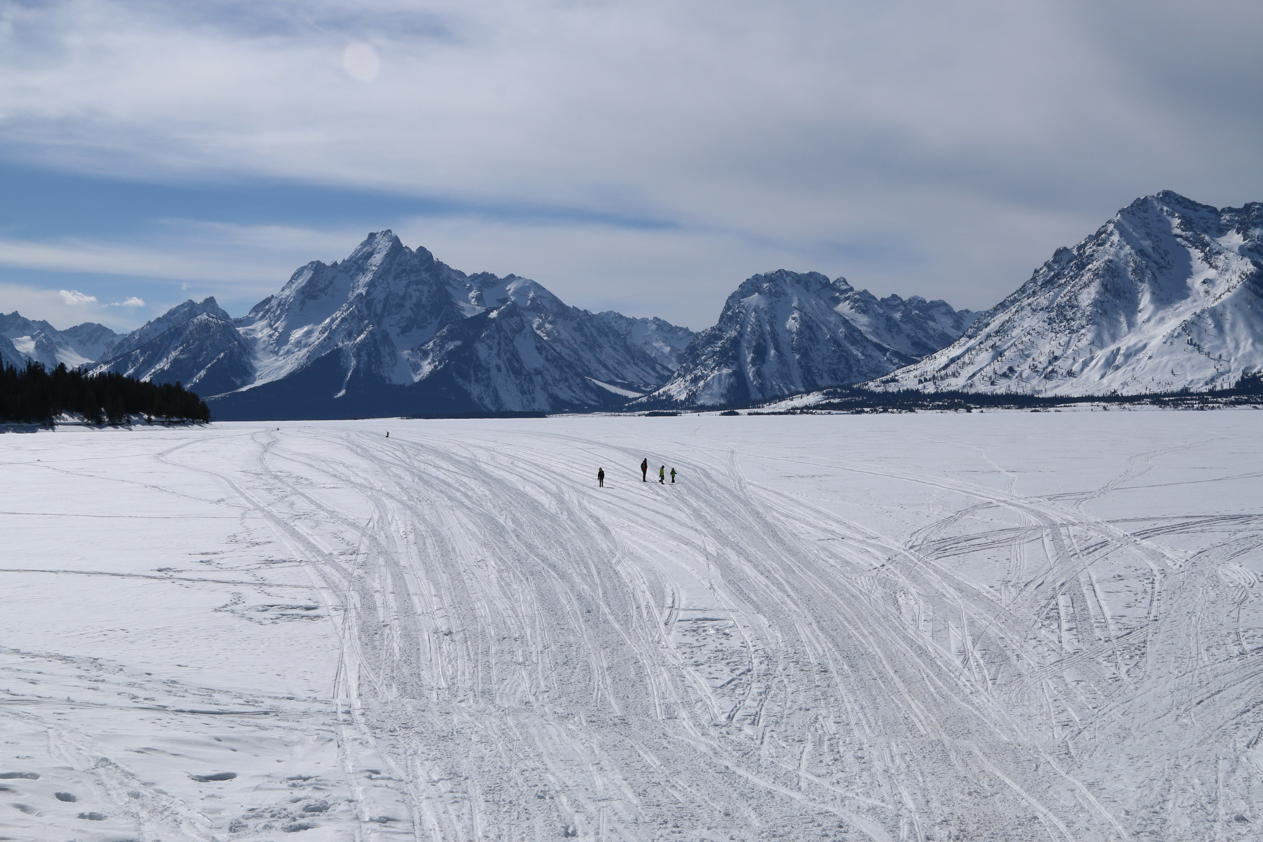 The Davies family walking out onto the frozen Jackson Lake