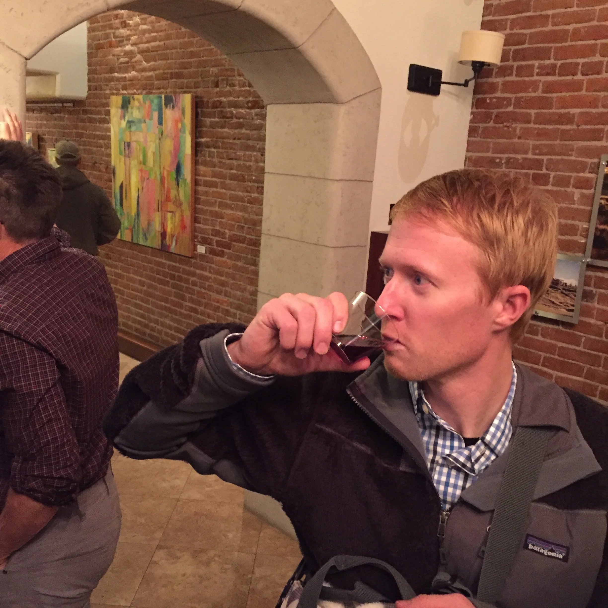 Our friend Caleb, sampling the wine!