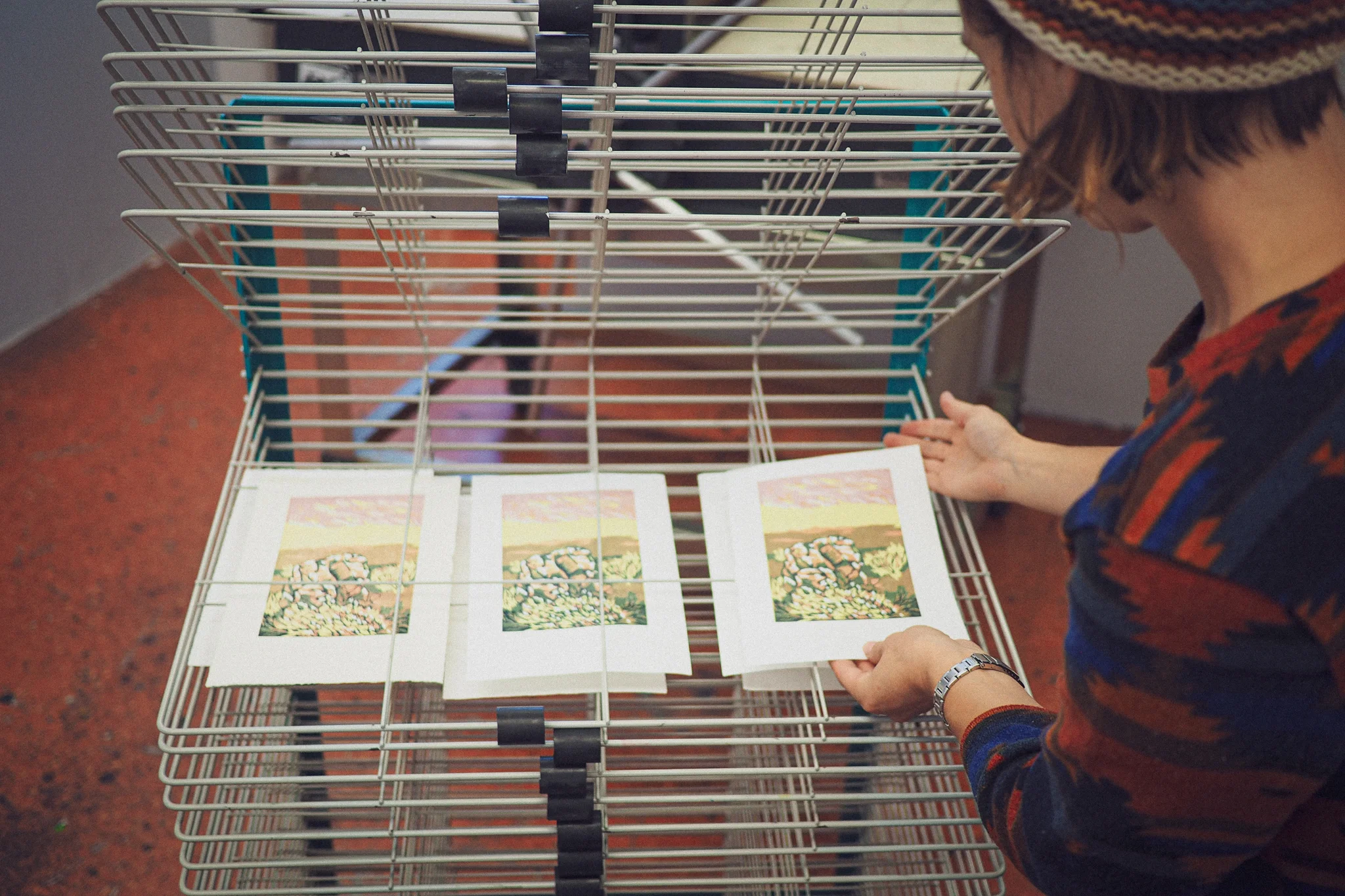 Artist Rachel Stiff (MFA) Printing an edition of reduction relief prints