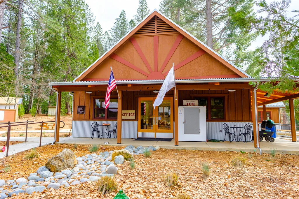 The office and front desk, complete with gift shop. Inside you will also find a common area with couches, a fireplace and a full kitchen. You will also find a new swimming pool to stay cool. 