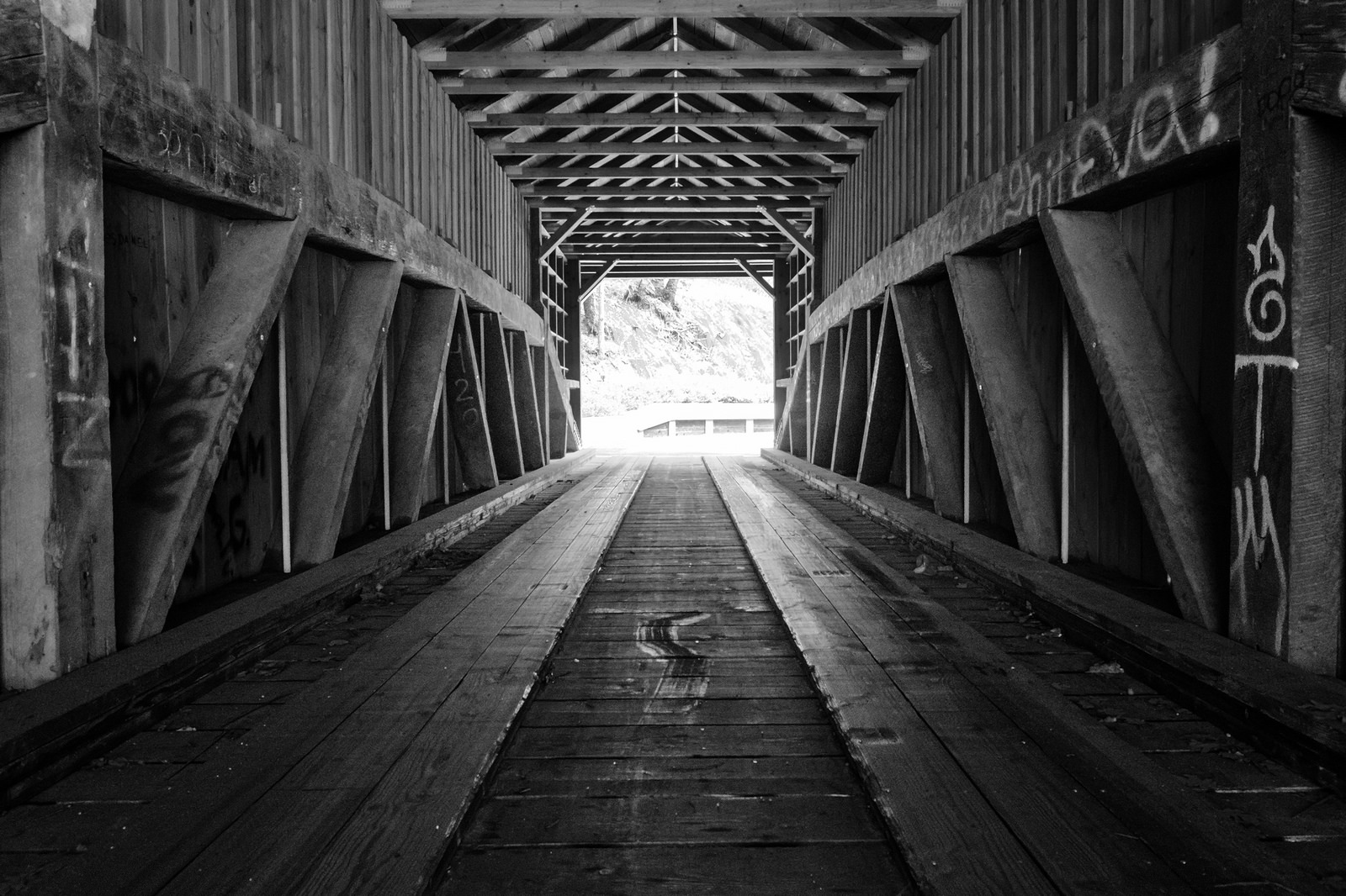 The rebuilt bridge uses some of the same wood that was used in the original bridge. 
