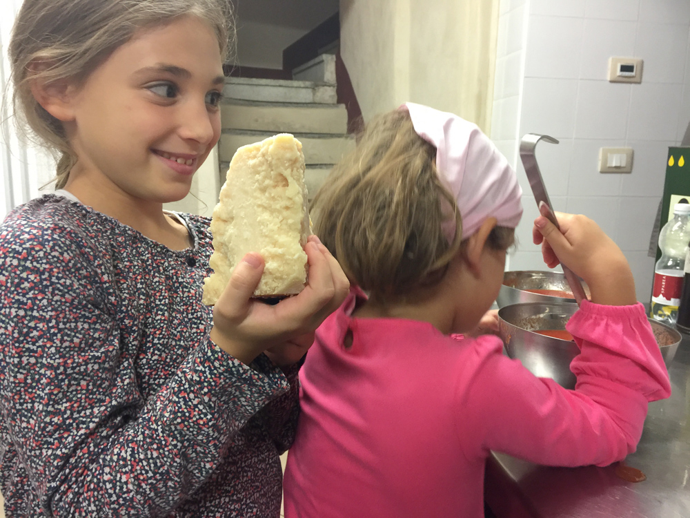 isabelle holding parmiggiano reggiano